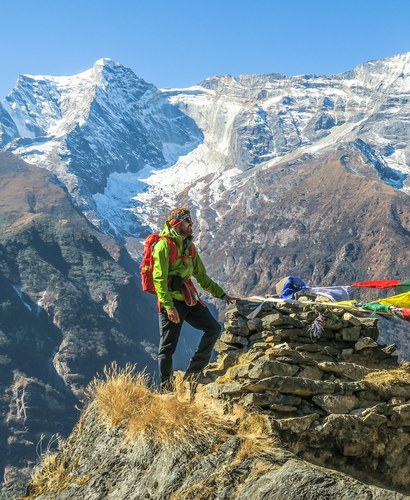 Trekker beside prayer flags high in the Khumbu